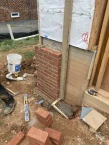 Brick columns added to the front of the garage wall