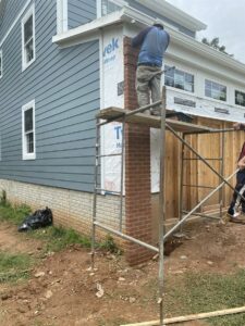 Brick columns added to the front of the garage wall