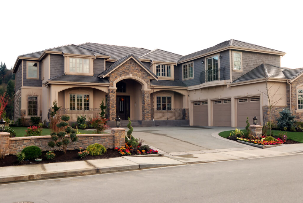 Large home with mixed siding and landscaping