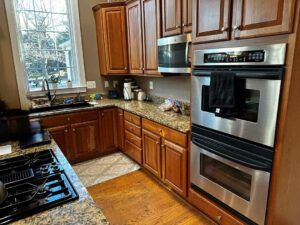 Before - Herndon, VA Kitchen Remodel: Transforming a Fireplace-Divided Living Space into an Open, Functional Layout
