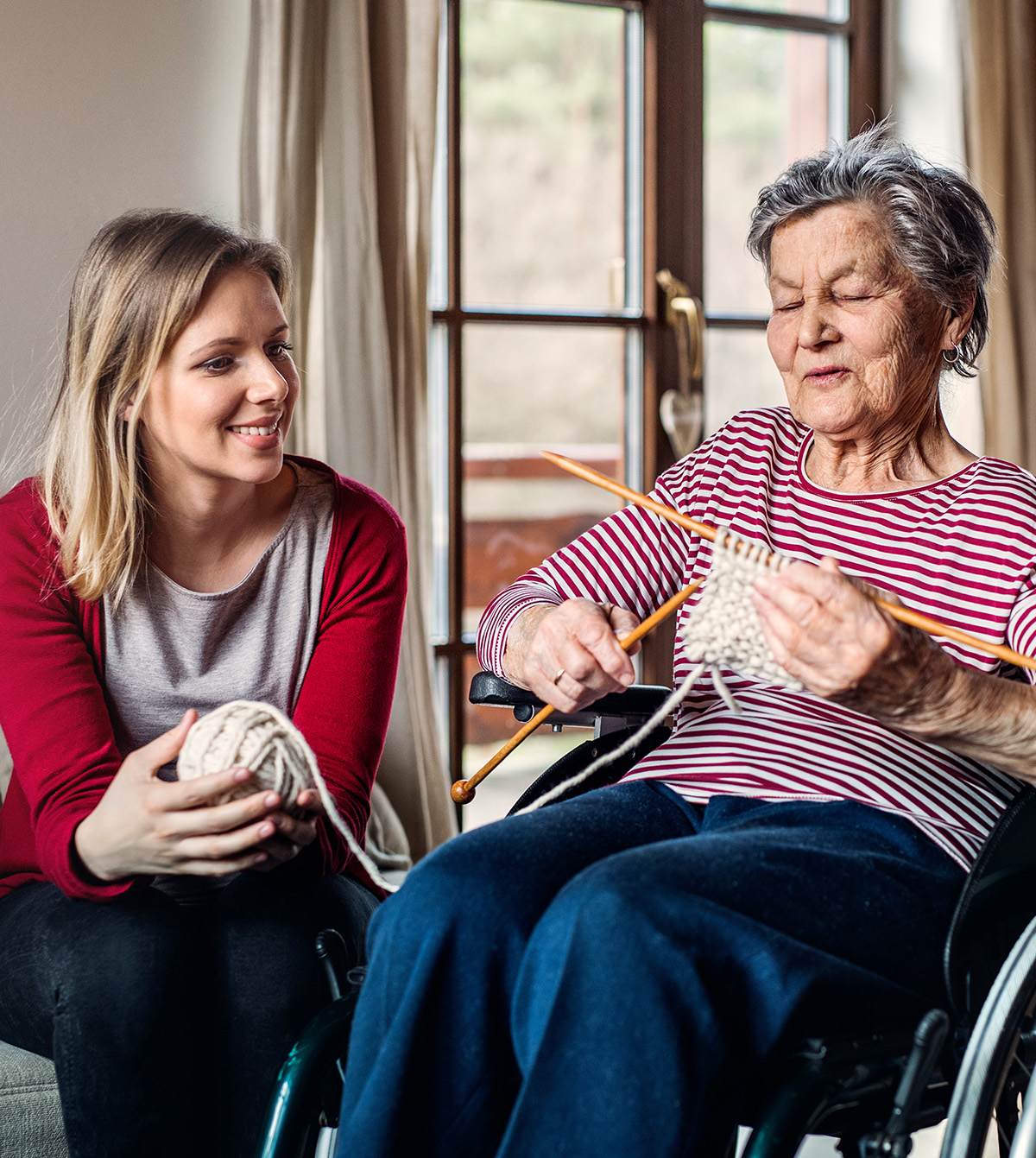 Daughter with grandmother knitting