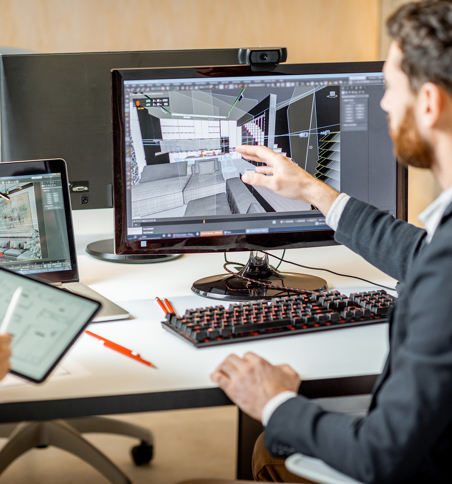 Employees making interior design on the computer and digital tablet.